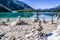 Stone pyramids, little man, mound, ovoo, Inukshuk made near the lake or the mountain river