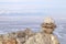 Stone pyramids for spirits on Olhon island. Baikal lake winter landscape