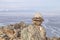 Stone pyramids for spirits on Olhon island. Baikal lake winter landscape