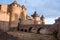 Stone rampart of a medieval castle in France at sunrise