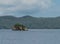 Stone reefs look out from a sea water close to the shore Singapur