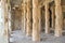 Stone reliefs on the Pillars inside a hindu temple at Hampi