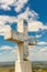 Stone religious cross on top of hills.