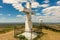 Stone religious cross on top of hills.