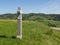 Stone religious cross on top of vosges hills