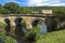 Stone road bridge over the River Derwent at Chatsworth house estate, Derbyshire