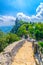 Stone road to Seconda Torre La Cesta Republic San Marino second fortress tower with brick walls on Mount Titano