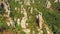 Stone rock needles stick out of the forest on the mountainside. bird`s eye view.