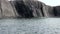 Stone rocks among water surface of Arctic Ocean on New Earth Vaigach Island.