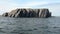 Stone rocks among water surface of Arctic Ocean on New Earth Vaigach Island.