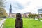 A stone sculpture and background of clock tower of Church of St. Michael, Hamburg, Germany. A landmark of the city and it is