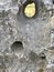 Stone sculpture in the park. Stone background, monument, decor, abstraction, hole in the stone, rock, nature.