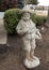 Stone sculpture of a young boy on the campus of The University of Central Oklahoma in Edmond.