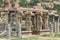 Stone sculptures and bas-reliefs on columns at the entrance to Pushkaran. Pushkarani is a sacred lake on the way to the Vitthala t