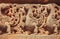 Stone sculptures on the Hindu temple walls with mythical peacocks and designed patterns. India.