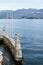 Stone sculptures on the pier near Villa Balbianello. Lake Como, Italy