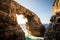 The stone sea arch at wied il-Mielah, Gozo, Malta. Sunny weather