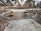 Stone seats in circle with sidewalk and Wilson bridge in Virginia