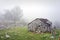 Stone shed in mountain with fog
