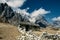 A stone shepherd shelter at the foot of the rocky mountains. Himalayas mountain landscape.