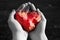 Stone shining red heart in hand
