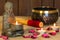 Stone sitting buddha, candles and Tibetan bowl. Around the candle, the atmosphere for meditation. Home comfort and relaxation