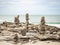 Stone stack on beach in Samed, Thailand. cloudy and big waves.