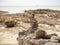 Stone stack on beach in Samed, Thailand. cloudy and big waves.