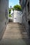 The stone stair in midtown Zurich alley on blue sky background