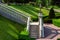 A stone staircase with balustrades railing down into the garden.