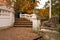 Stone staircase with fallen leaves in park autumn