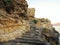 Stone staircase ladder on rocks near sea in Greece