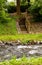 Stone stairs above the river. Descent into the water. Wooden balustrades.