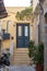 Stone stairs drives to house at capital of Syros island, Hermoupolis, Cyclades, Greece. Vertical