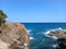 Stone stairs in rock leading down to the sea. Ancient stone steps in the rock. Stairs to the sea. Nature, cliffs and coastline