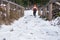 Stone stairs in the snow and ice. Dangerous descent down the stairs