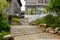 Stone stairway before old-fashioned buildings in cloudy spring