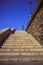 Stone stairways at the center of the city during a sunny day.