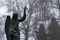 Stone statue of an angel on Cemetery during dark misty morning or night.