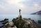 Stone statue in front of the sea bay in the Croatian town of Opatija