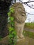 Stone statue of lion on gatepost