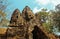 Stone statues of faces in Cambodian Angkor Wat Temple near Siem Reap city in Asia