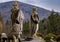 Stone statues and a stone lion in a public garden