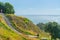 Stone steps down track up Mount Maunganui with view beyond to Pacific Ocean