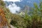 Stone steps on the steep slope of Machu Piccu Mountain with view on the Machu Picchu Inca citadel