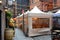 Stone Street Restaurants set up tents in the a narrow cobblestone street in the heart of the Financial