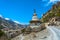 Stone stupa on the edge of a mountain road, Nepal.