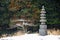 Stone stupa in snow Japanese garden