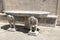 Stone table with male figures near the church on the island of Gospa od Skrpela in the Boko-Kotorsky Gulf.