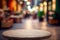 Stone table top with blurred shopping plaza background. Empty tabletop over defocused background for product display or